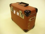 Suitcase "Soldier", ex. Num. 24;  35 x 26,5 x 15,5 cm, date: 2nd half of 20. century; brown lacquered carton, mounting, plastic corners and handle, two locks;  District Military Board Brno-venkov, originaly used for transportation of secret documents, later for personal agenda;  Donated by Mr. LT Pavel Liška, Brno, 2007