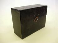 Black Box, ex. Num. 36  14,5 x 26 x 35,1st half of 20th century  Carton with black vinyl, top opening, holes for sealing and rivets (spikes)  Originally used for documents of bureau of (so called) 1. Republic.  Donated by National Archive in Prague, V/2007