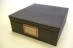 Box with drawer, ex. Num. 14;  Cloth, black and green stripes,  40 x 15 x 38 cm, date: (?);  Donated by MZA Brno, 2006