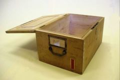 Wooden Box. ex. Num. 34;  31 x 24 x 47 cm, 19th century  Unfinished tint wood, mounting,  handle and lock  Box for storing Czech Crown documents  Provincial Archive in Prague. Donated by National Archive in Prague, I. Dep., V/2007