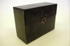 Black Box, ex. Num. 36  14,5 x 26 x 35,1st half of 20th century  Carton with black vinyl, top opening, holes for sealing and rivets (spikes)  Originally used for documents of bureau of (so called) 1. Republic.  Donated by National Archive in Prague, V/2007